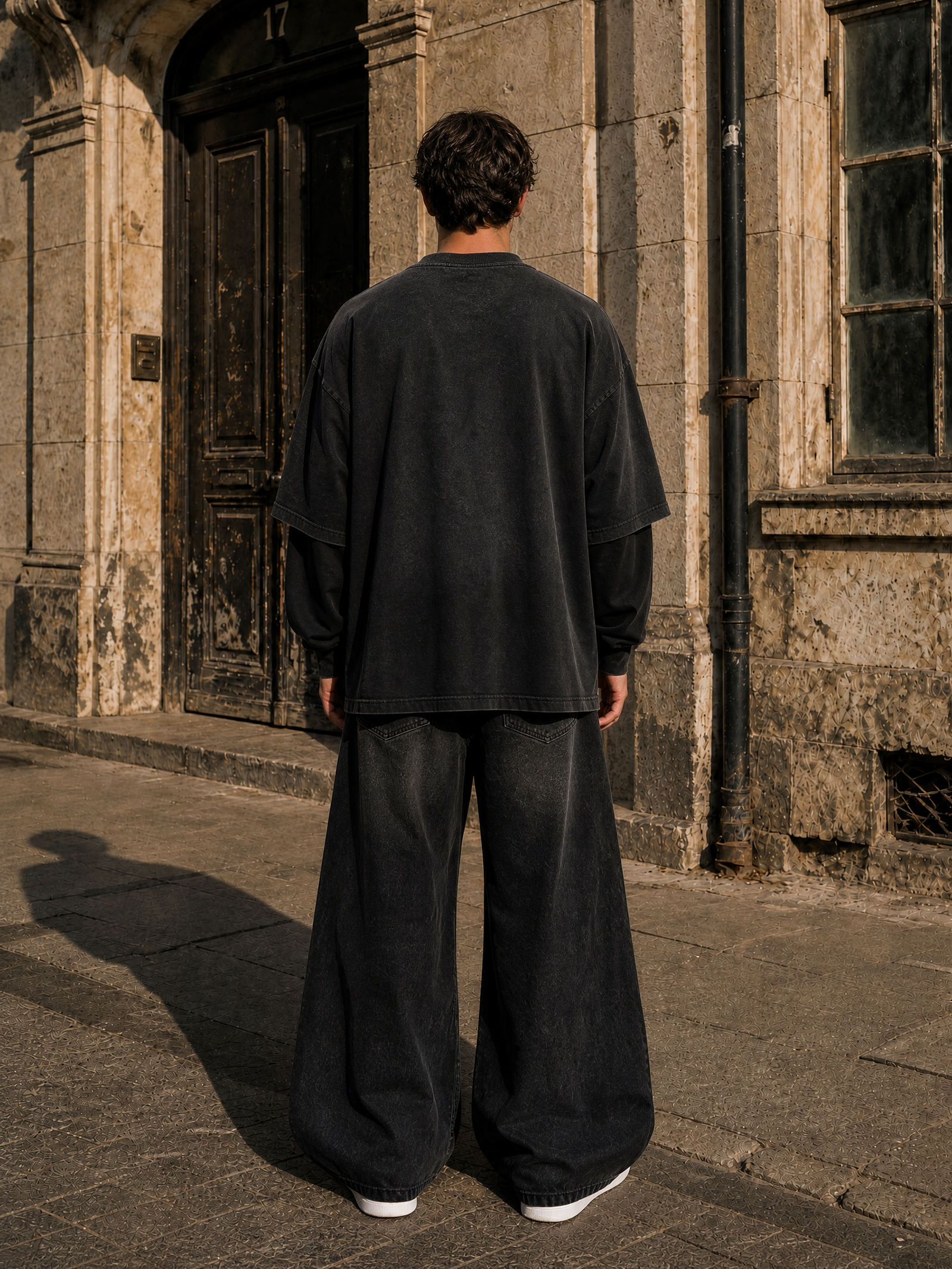 KEY ATELIER Sunfade Hand-Frayed Faux Two-Piece T-Shirt in Black – side or styling view