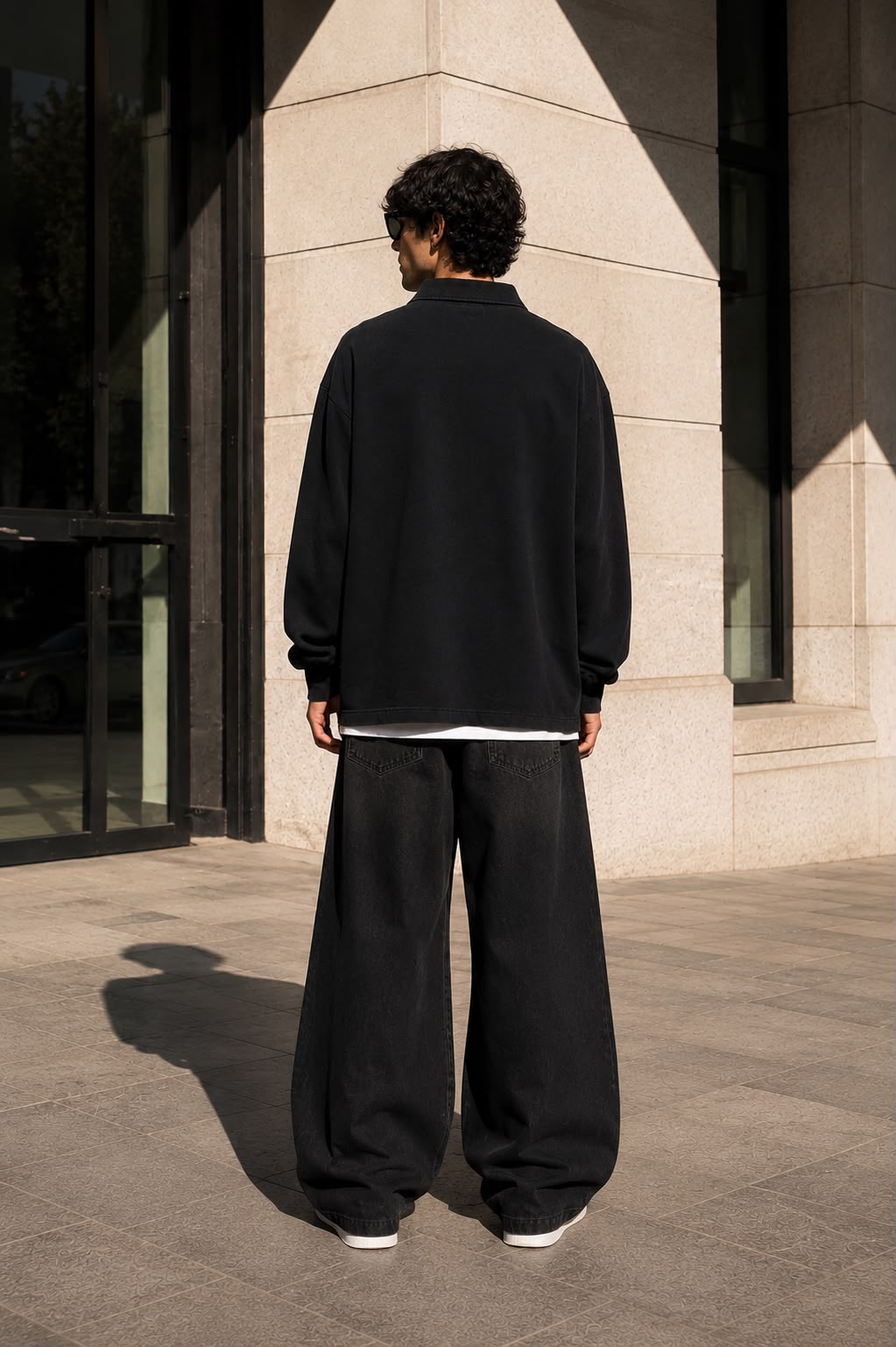 KEY ATELIER Loose Long Sleeve Polo Shirt in Black – rear or styling view