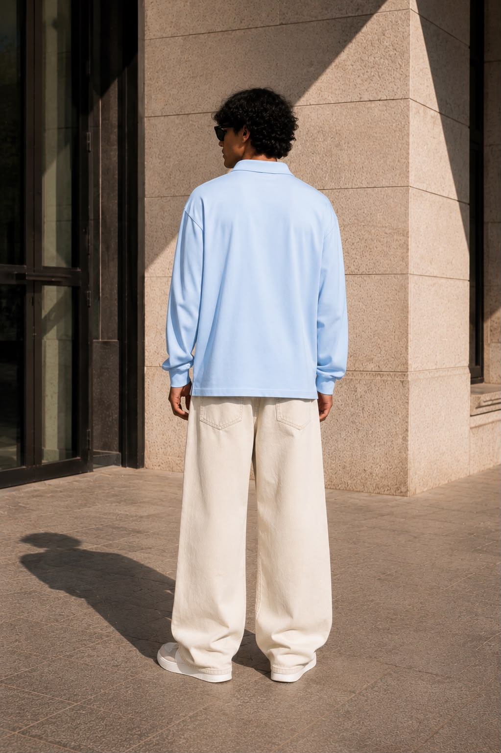 KEY ATELIER Loose Long Sleeve Polo Shirt in Sky Blue – side or styling view